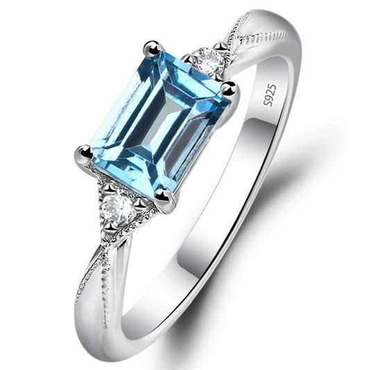 Azure Radiance™ Emerald Cut Blue Topaz Ring – 18K White Gold
